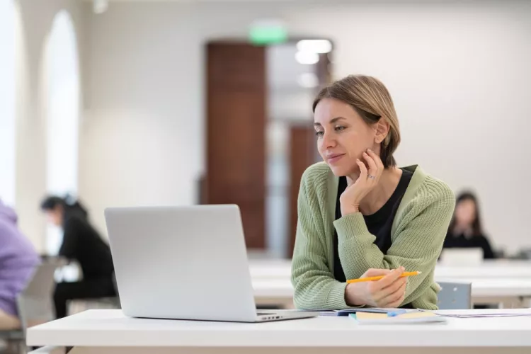 Woman looking at laptop